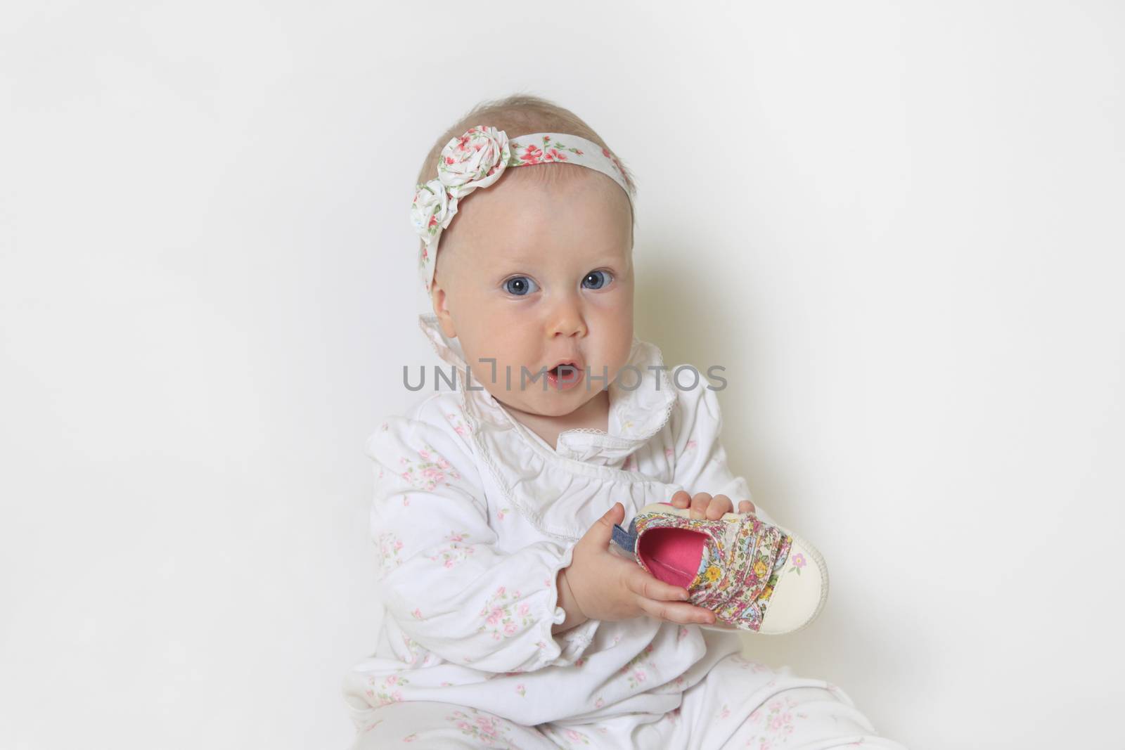 Beautiful small kid girl in studio