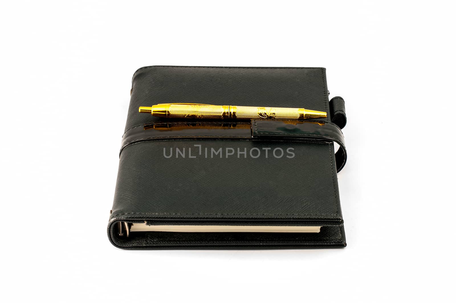 Black note book with ballpoint pen by Sorapop