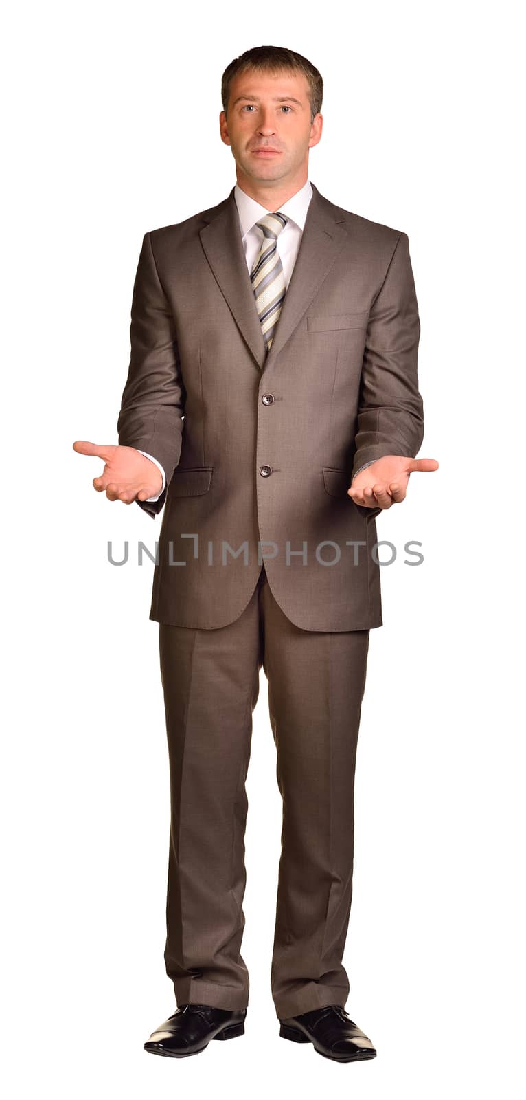 Businessman holds her hands in front of him. Isolated white background