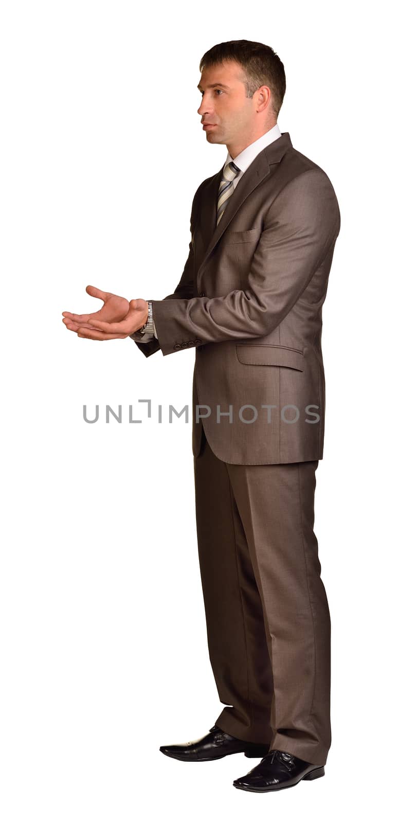 Businessman holds her hands in front of him. Isolated white background