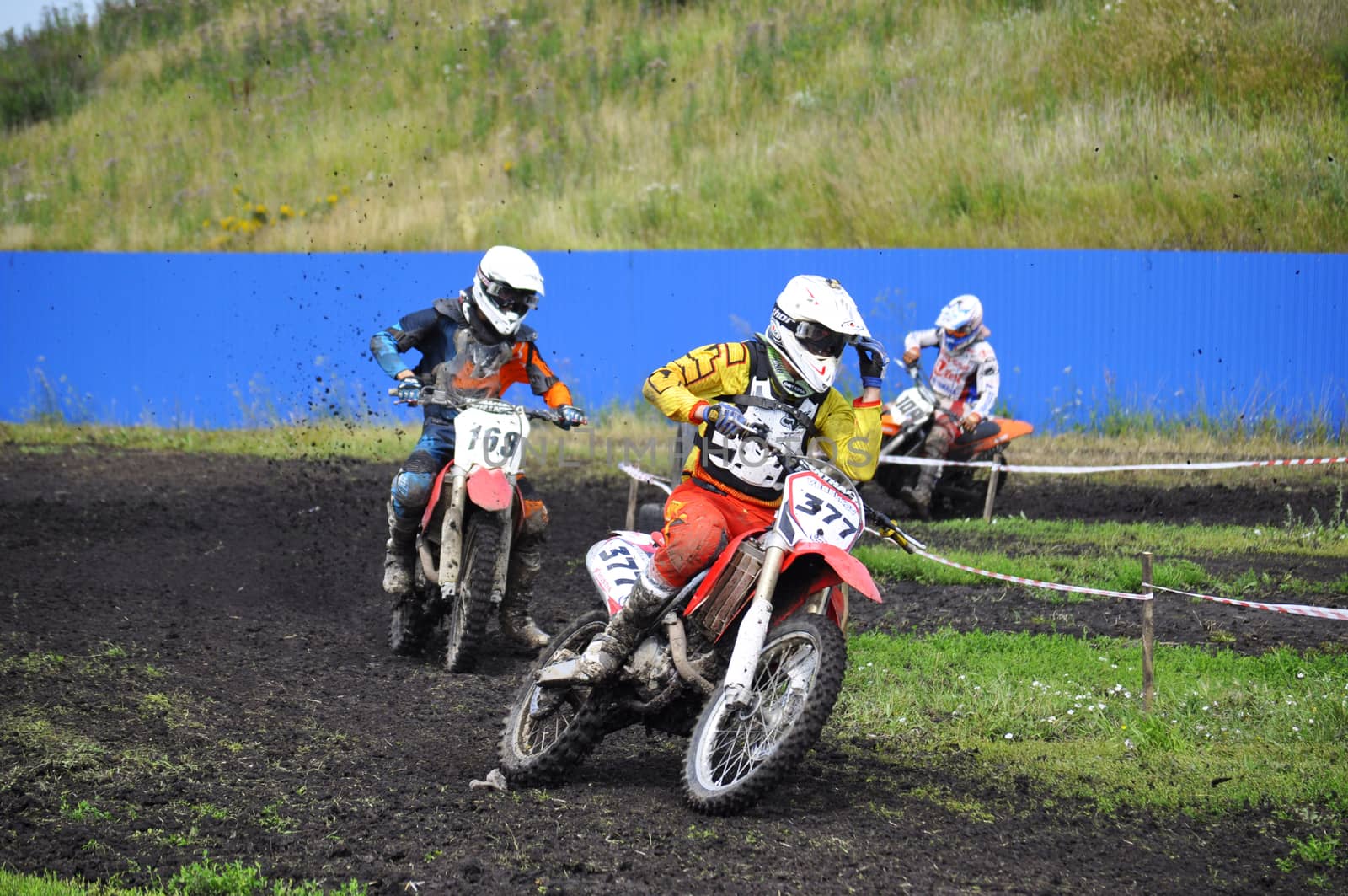 Racers on motorcycles participate in cross-country race competitions. 02.08.2014, Tyumen