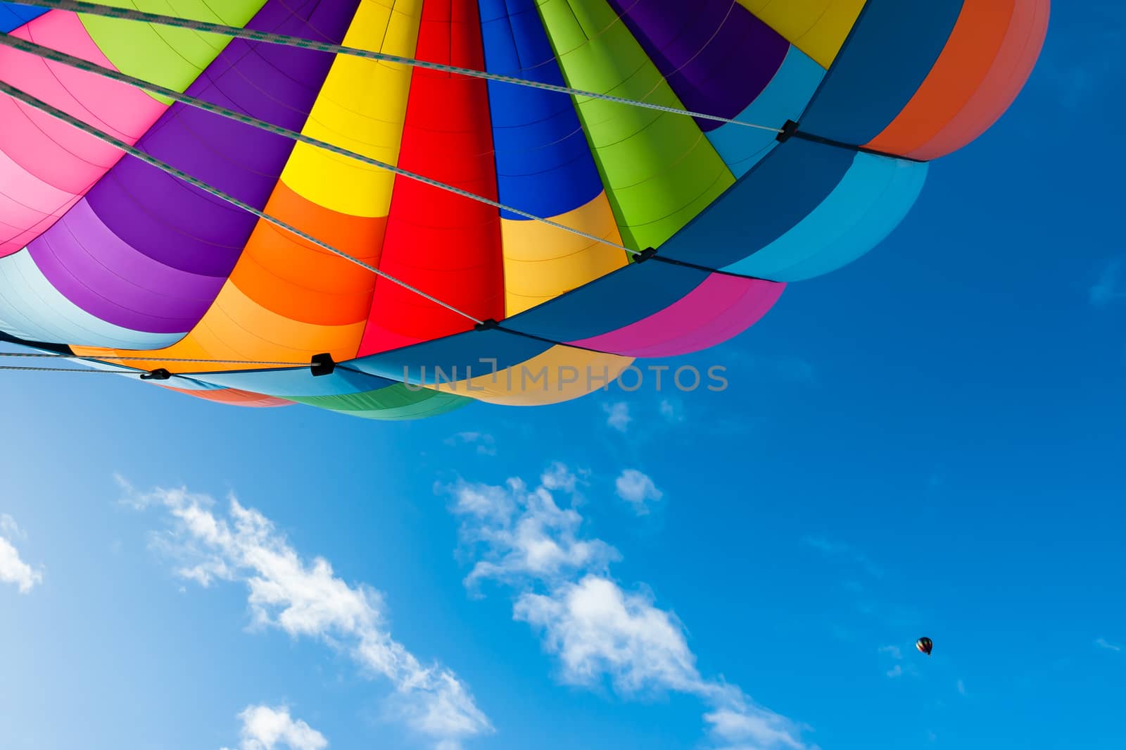 Colorful hot air balloon flying in the blue sky. Fun and happiness. A relaxing flying experience.