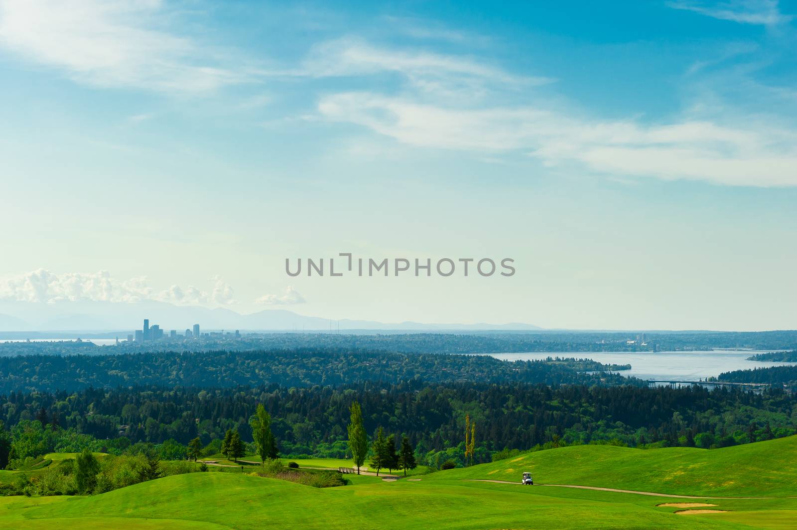 Golf Course with Green Grass and Seattle Downtown at the Backgro by chentim