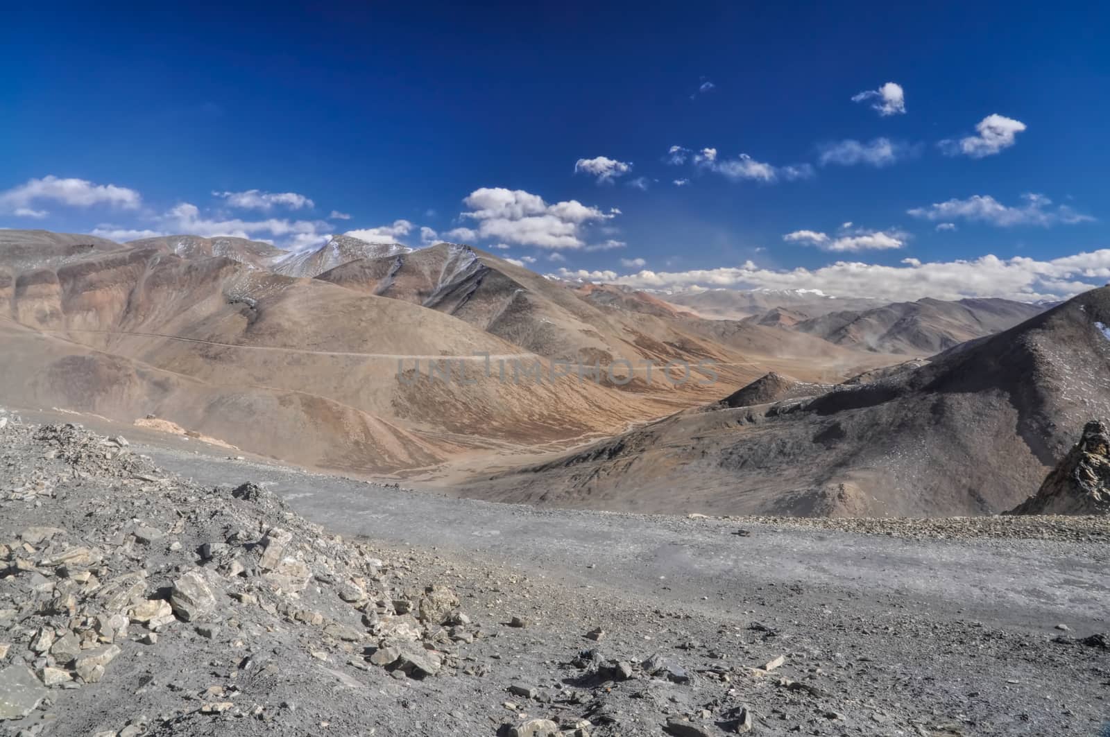 Rocky road leading through the mountains on the way to Ladakh, India