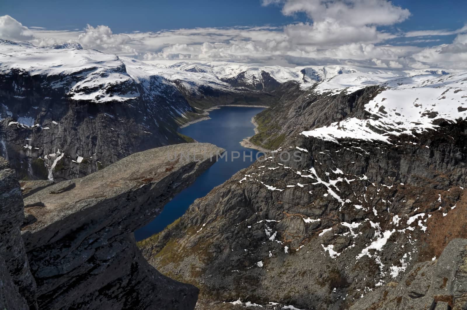Scenic view of Trolltunga rock  and the surrounding mountains in Norway