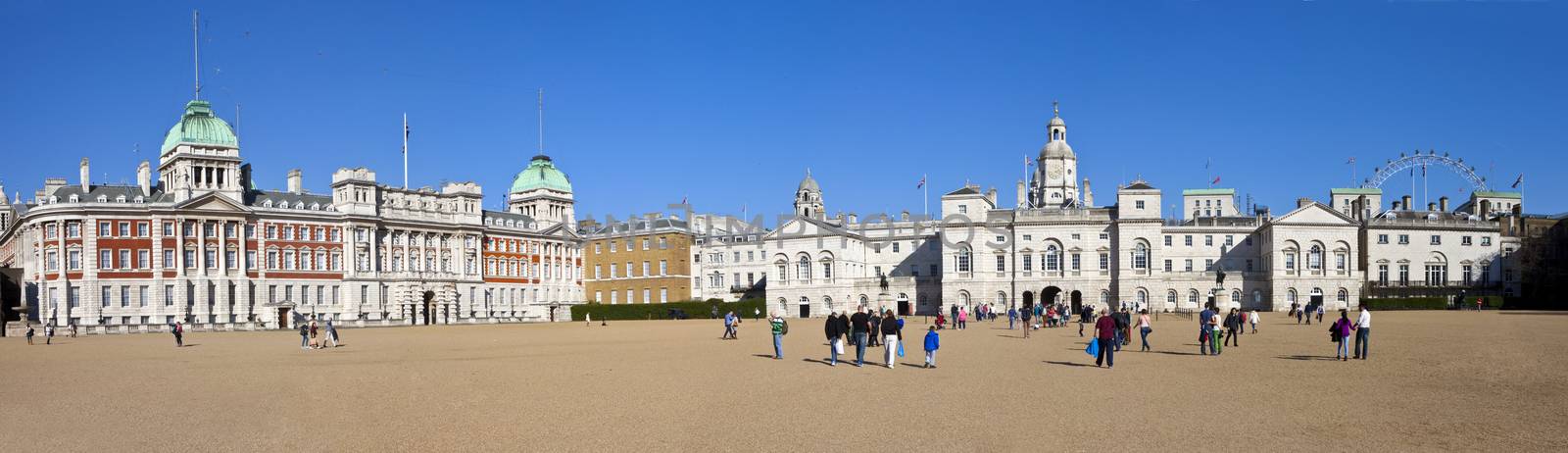 A panoramic view of the impressive Horseguards Parade in London.  The London Eye can be seen in the distance.
