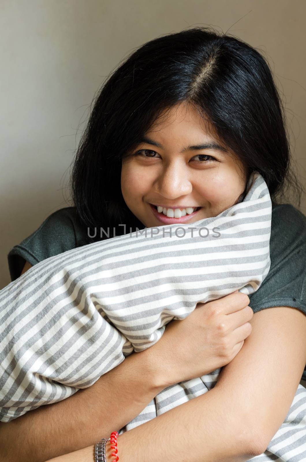 Funny woman holding pillow  by siraanamwong