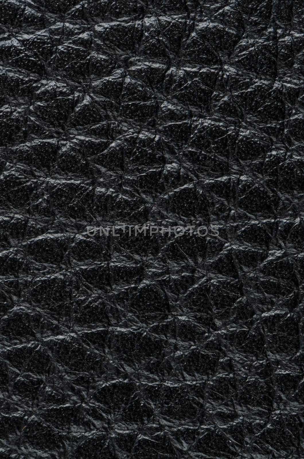 Natural qualitative black leather texture. Close up.