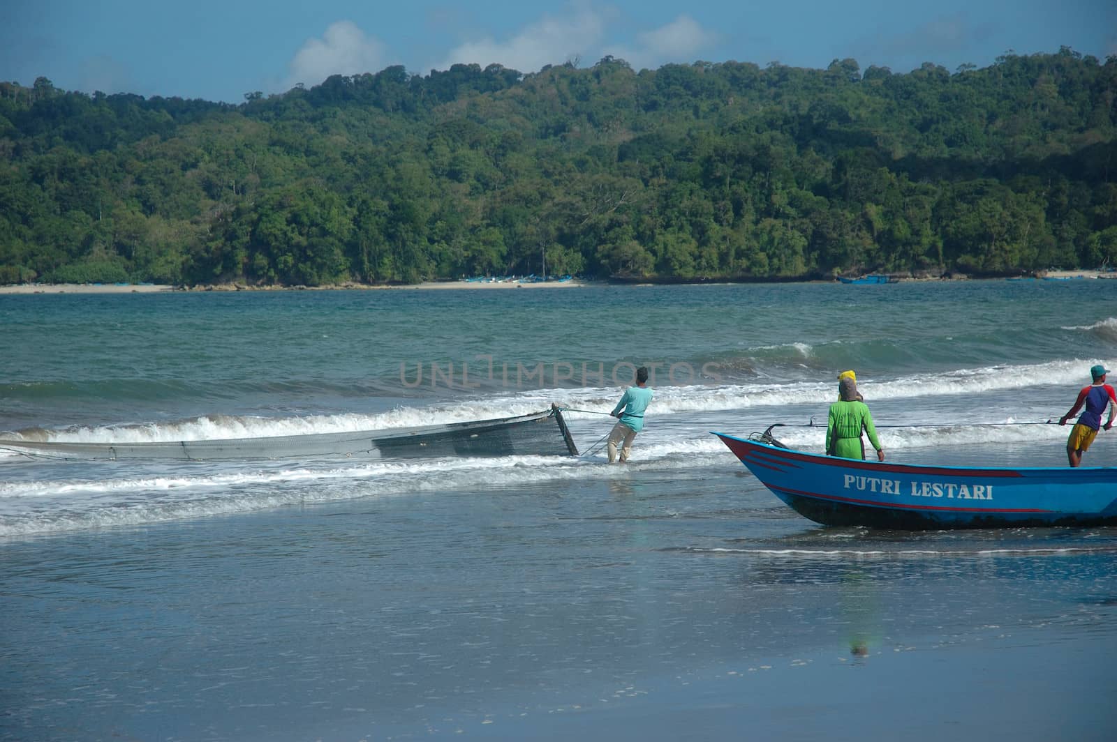 Pangandaran, Indonesia - July 16, 2011: Fisherman at Pangandaran beach, West Java-Indonesia.