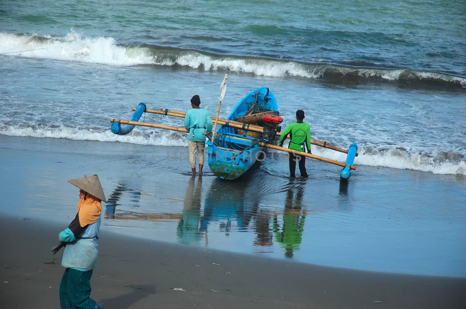 Pangandaran, Indonesia - July 16, 2011: Fisherman at Pangandaran beach, West Java-Indonesia.