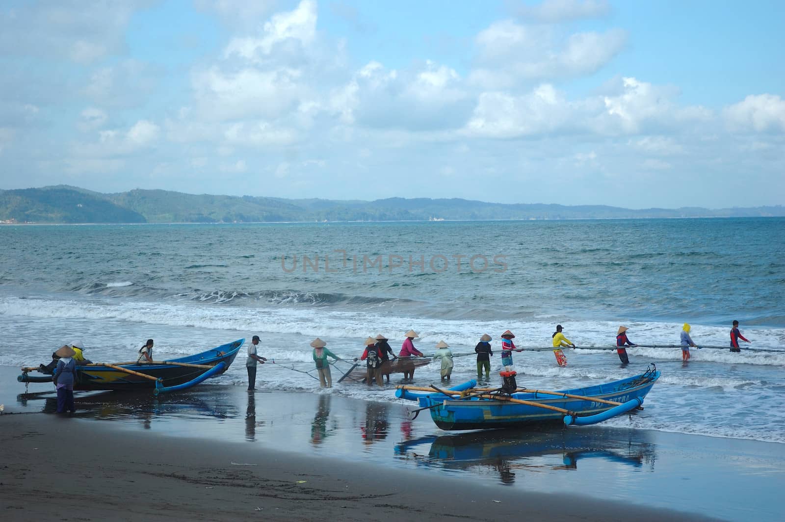 Pangandaran, Indonesia - July 16, 2011: Fisherman at Pangandaran beach, West Java-Indonesia.