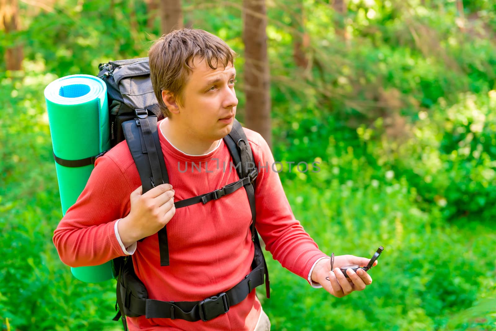 a lost tourist in a hike with compass