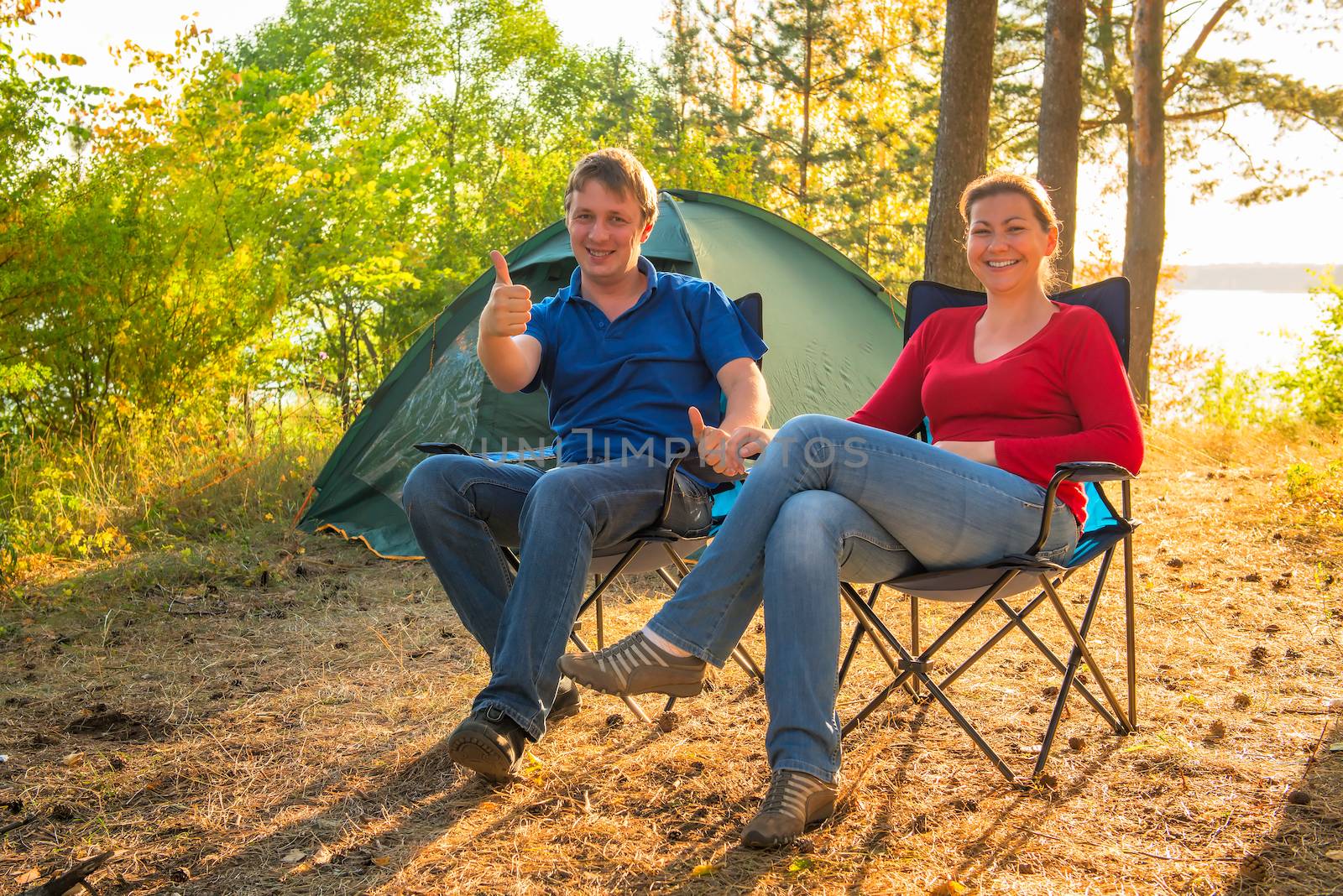 happy and cheerful couple camping on the nature by kosmsos111