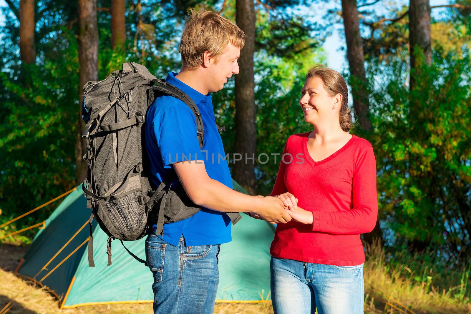 happy couple in a summer day camping