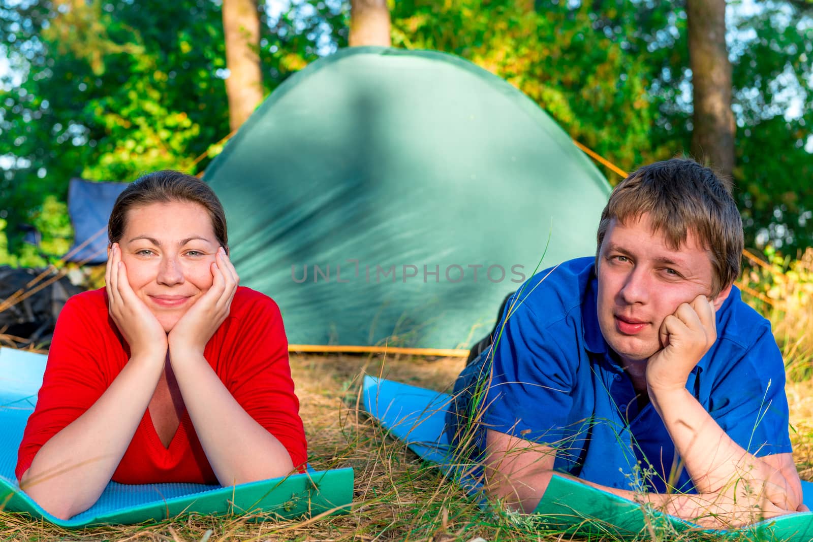 Man and woman lying in camping resting by kosmsos111