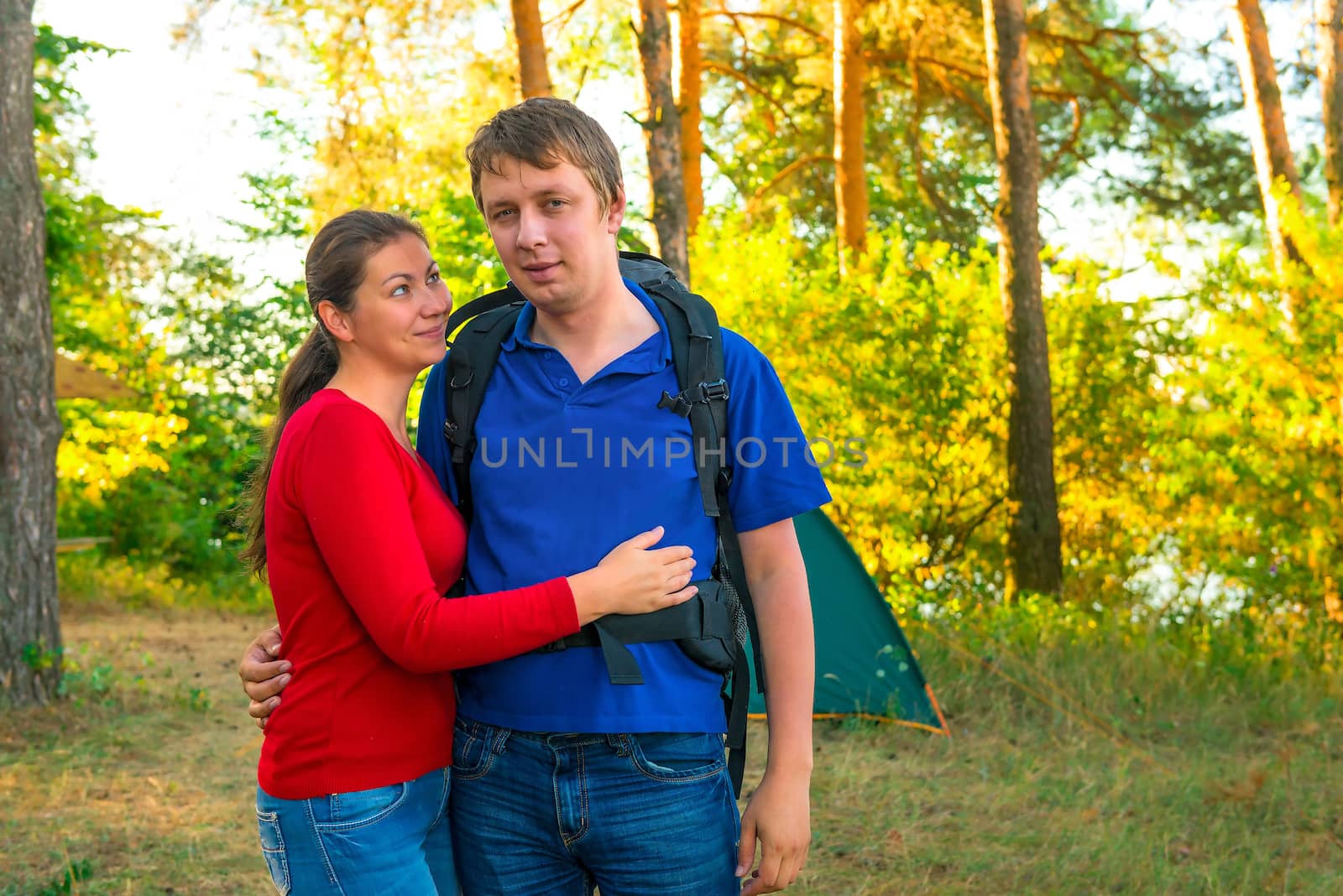 young couple resting family camping