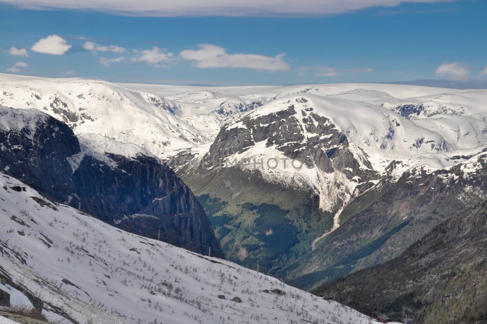 Scenic view of sunlit slopes of Norwegian mountains near Trolltunga