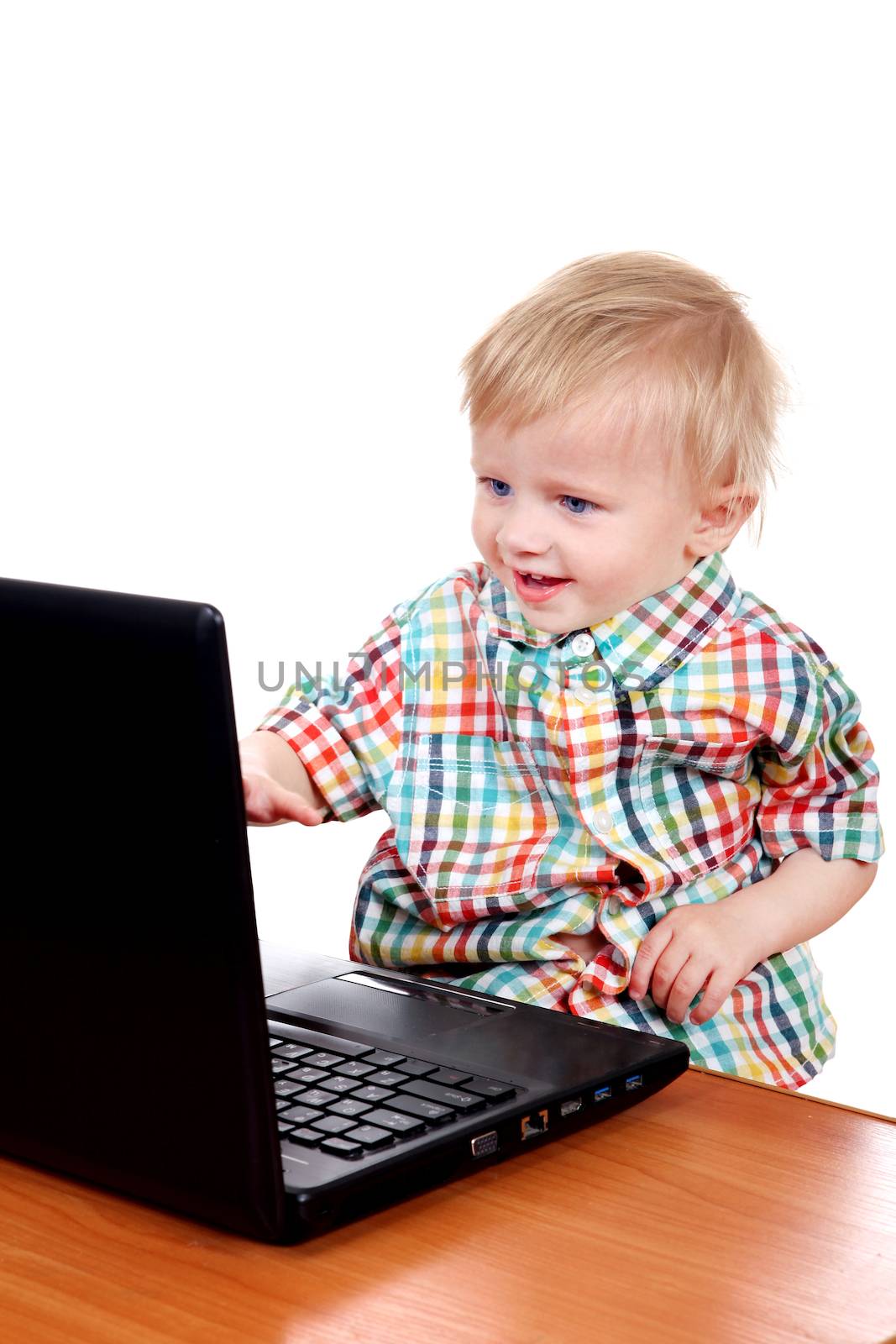 Cheerful Baby Boy with Laptop Isolated on the White Background