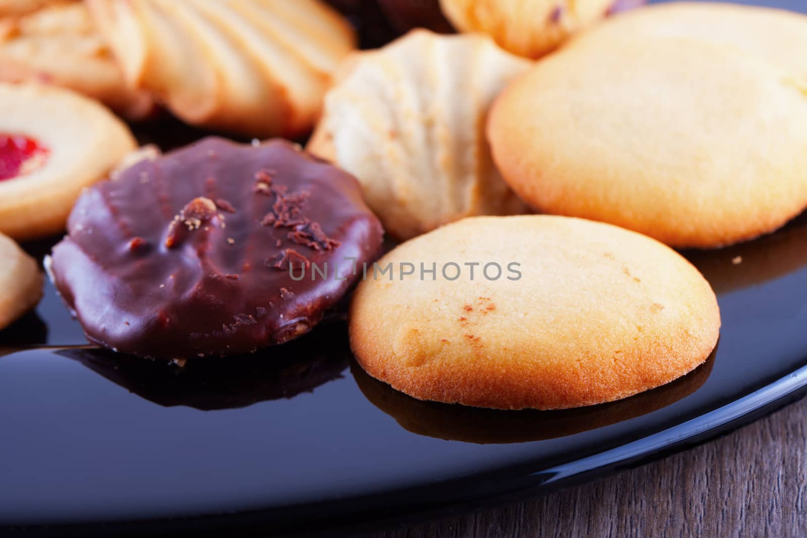 Biscuits of various kinds over a black plate