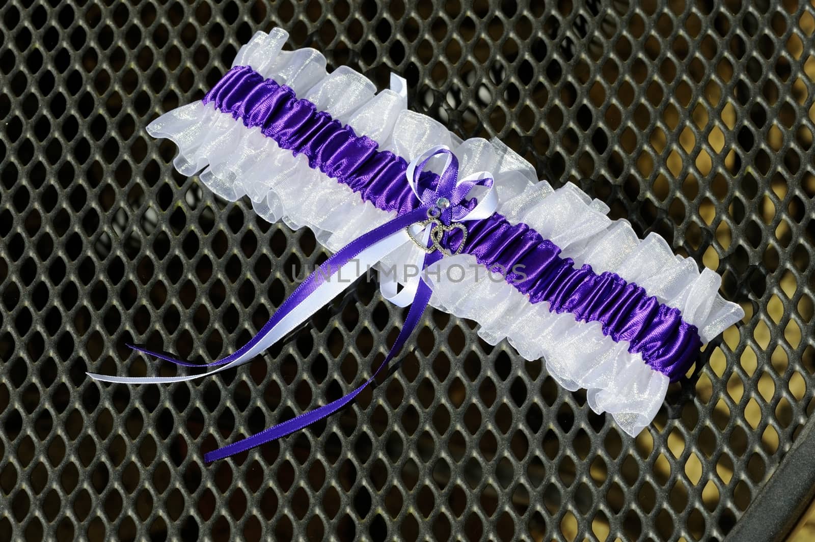 Brides purple and white garter closeup