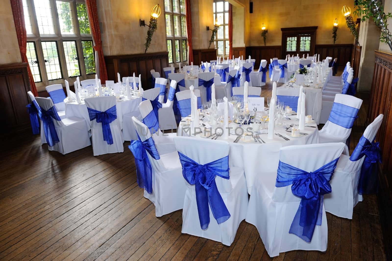 Wedding reception setting with blue and white decorations