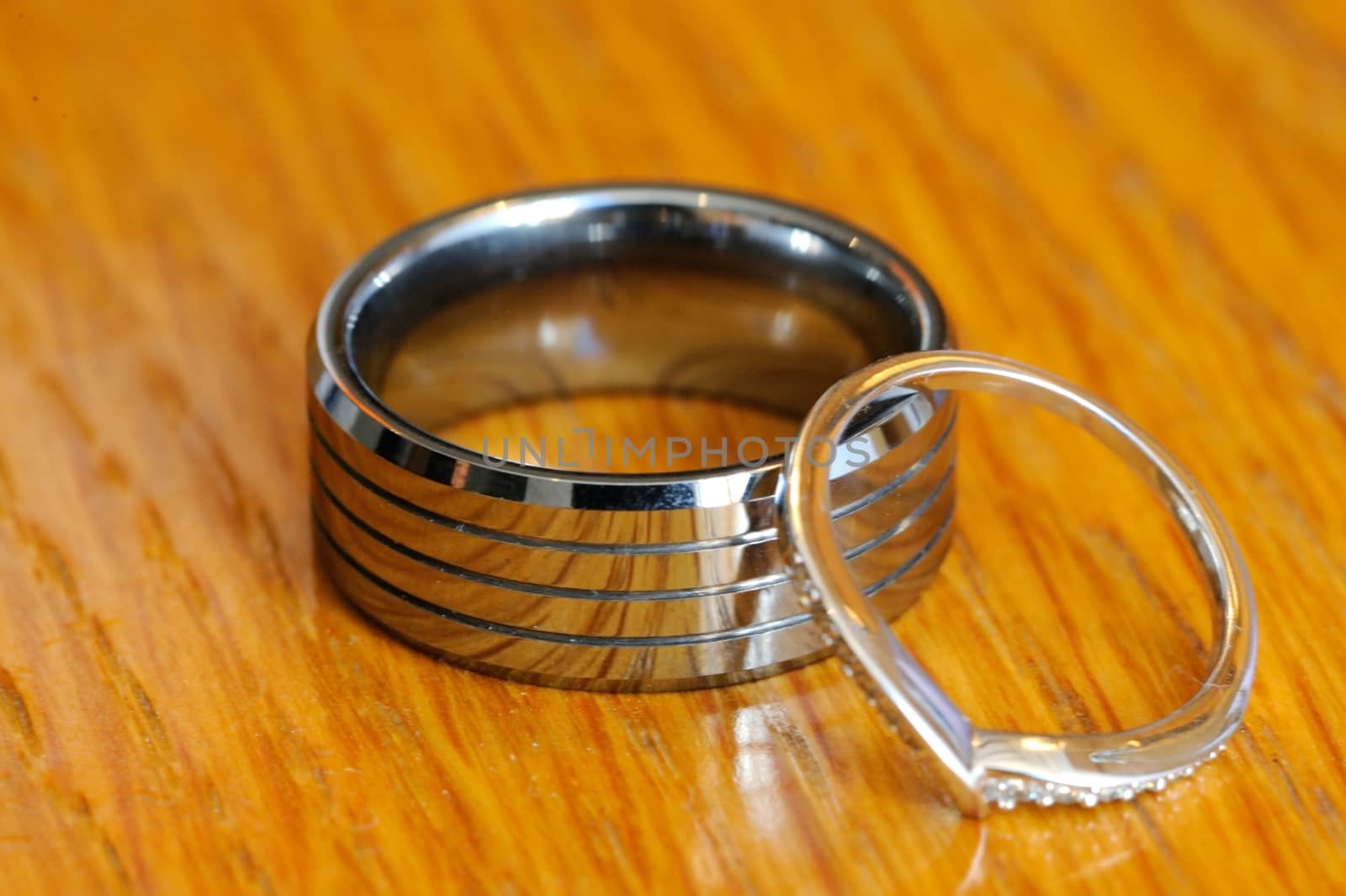 Macro detail of bride and grooms rings on wedding day