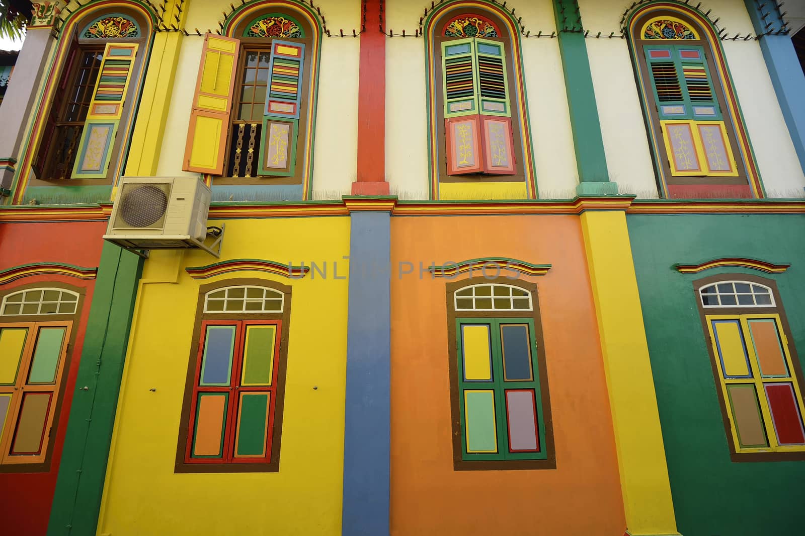 Color shutters and color facade of building in Little India, Sin by think4photop