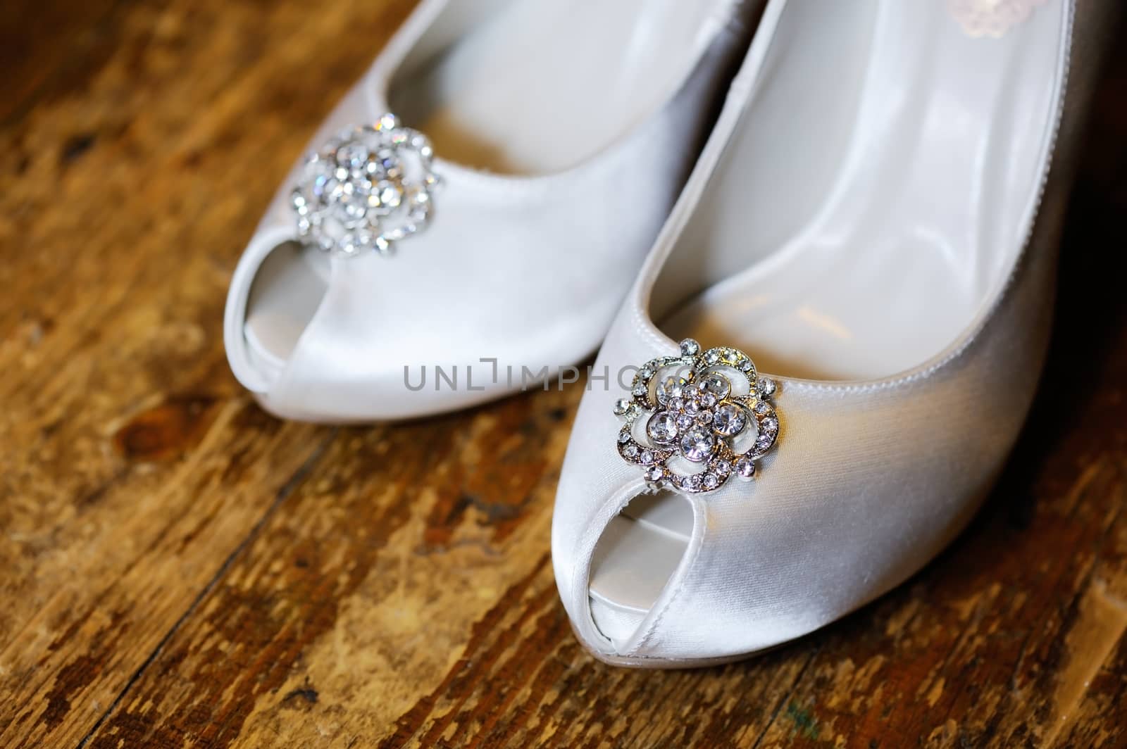 Closeup of brides shoes showing detail on wedding day