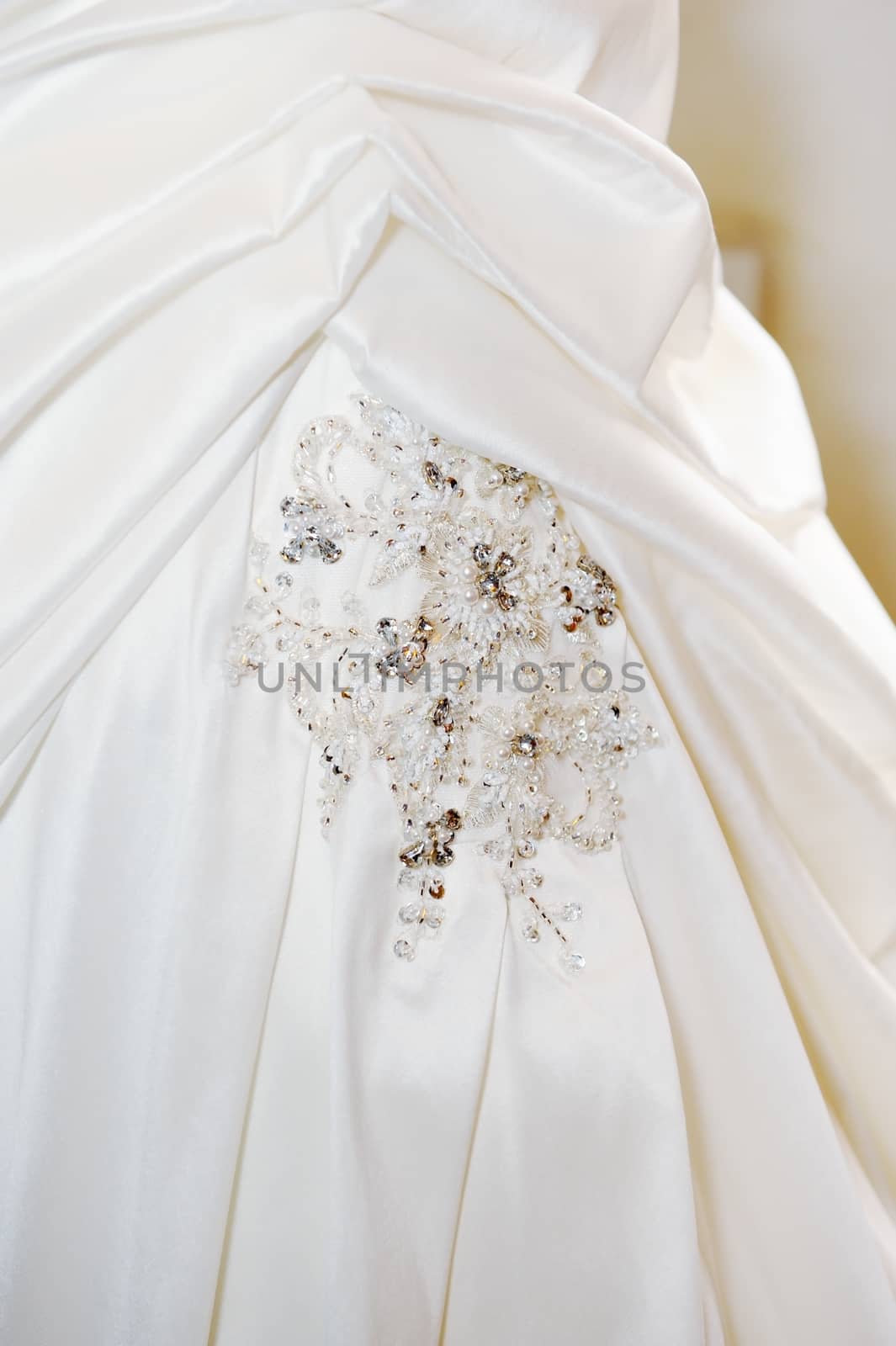 Closeup of brides white wedding dress