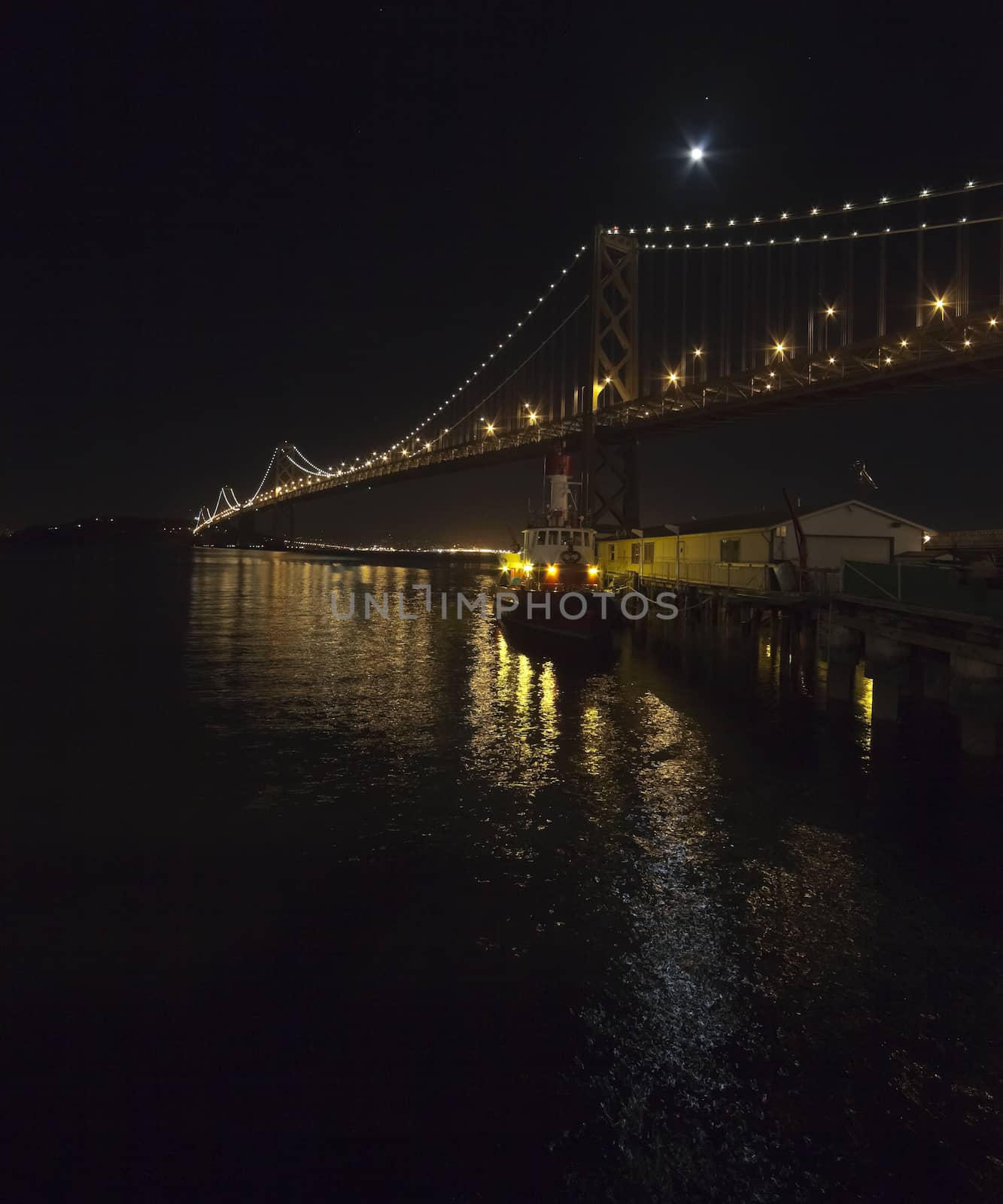 San Francisco Bay bridge in the night by hanusst