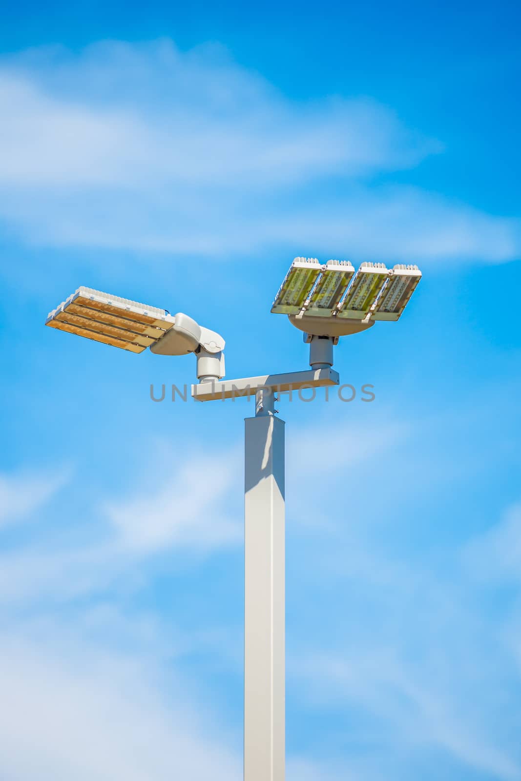 LED street lamps post on blue sky background