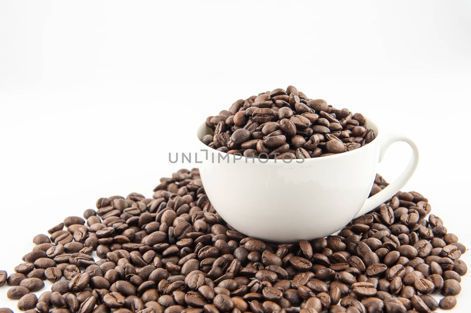 Cup and coffee beans