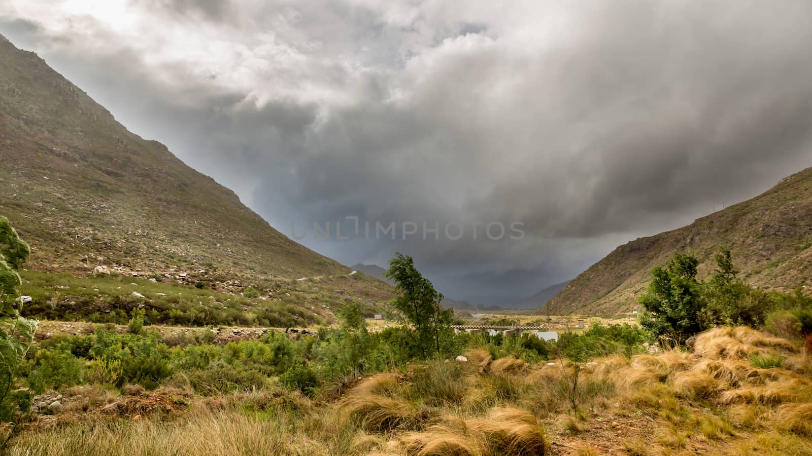 Stormy clouds settling down on the tall mountains of the picturesque landscapes of the Western Cape regions of South Africa