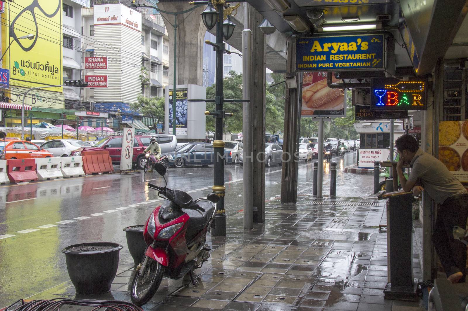 BANGKOK, THAILAND-SEPT 25TH: Sukhumvit road during a rainstorm o by khellon