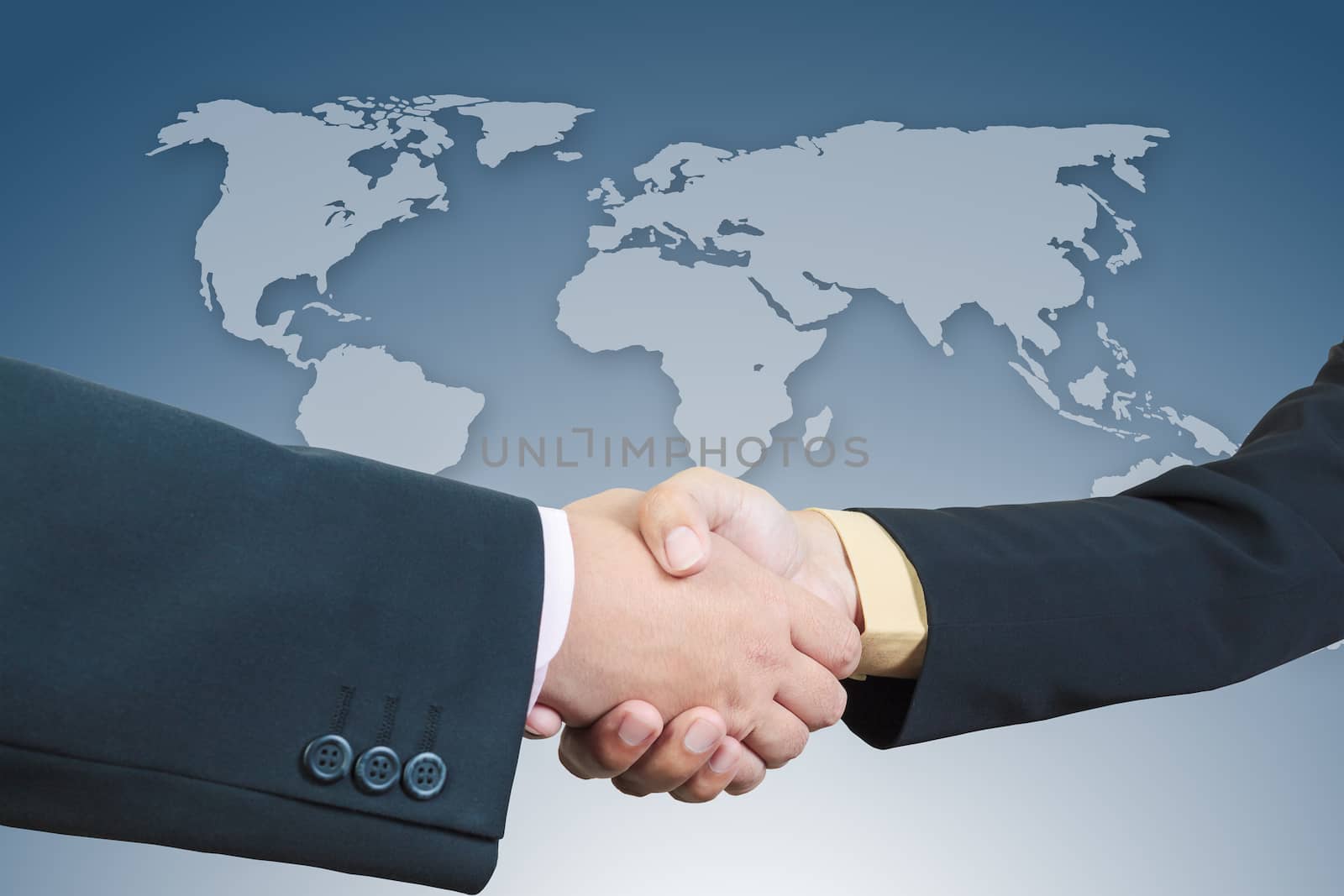 Businessman handshake with world map background