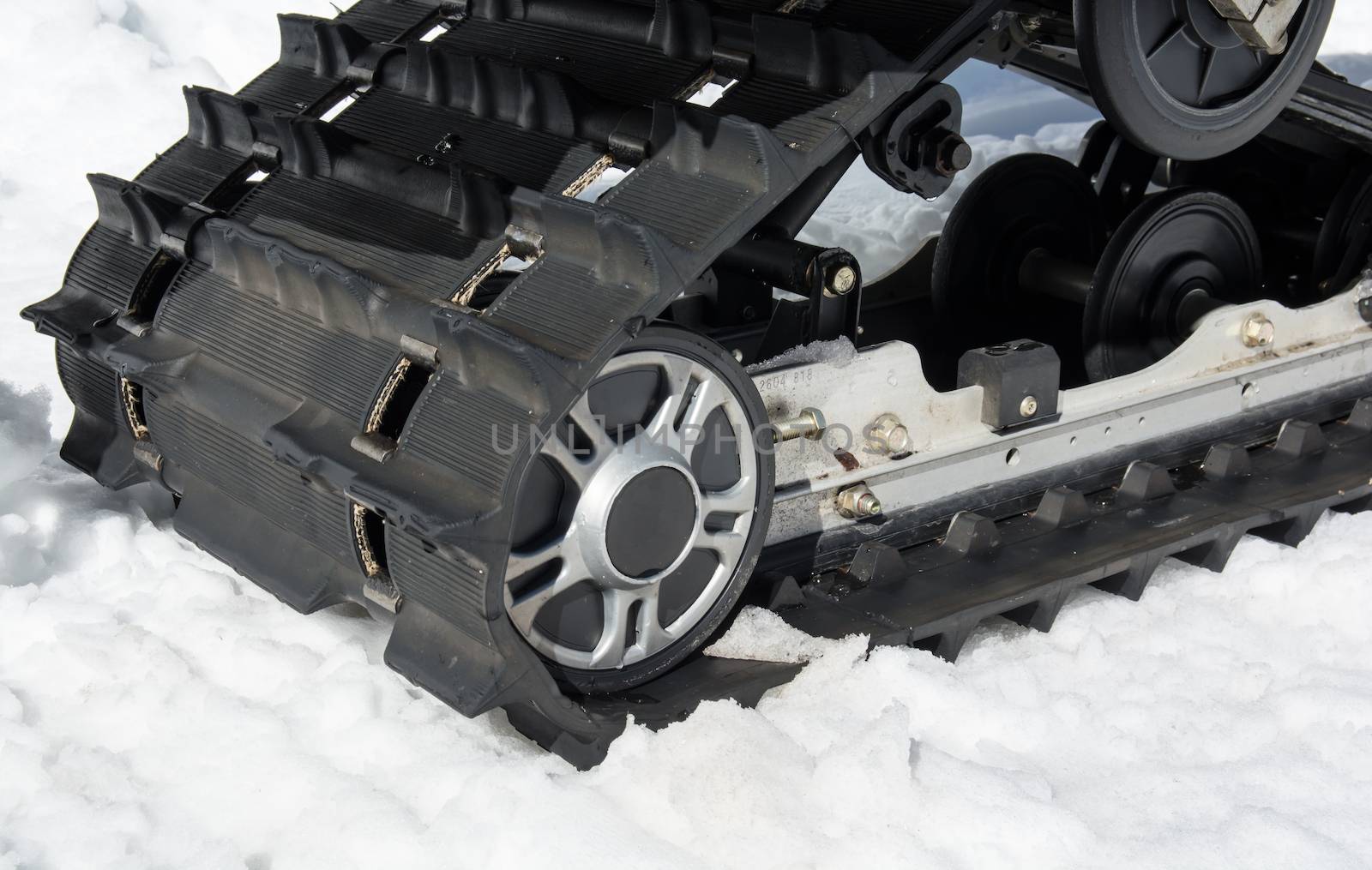 closeup of caterpillars on a snowmobile