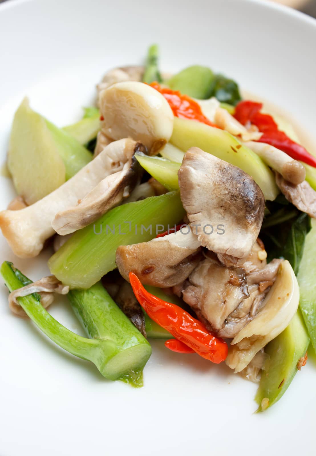 Stir fried straw mushroom and Chinese kale by vitawin