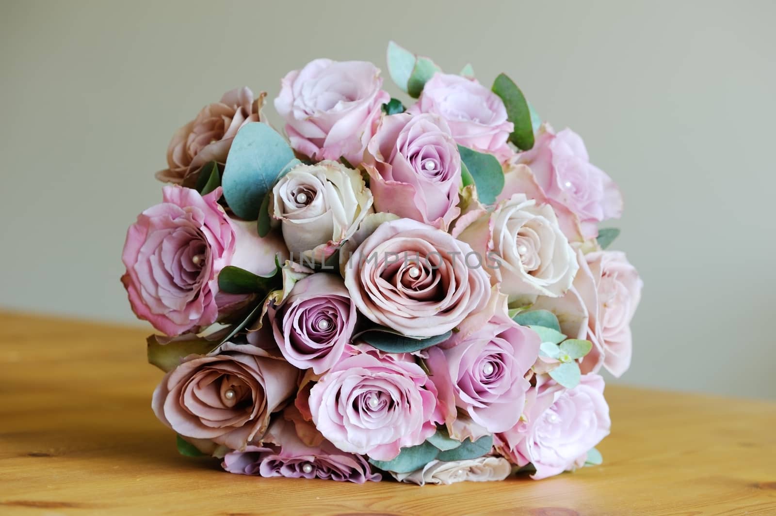 Brides bouquet of pink roses on wedding day