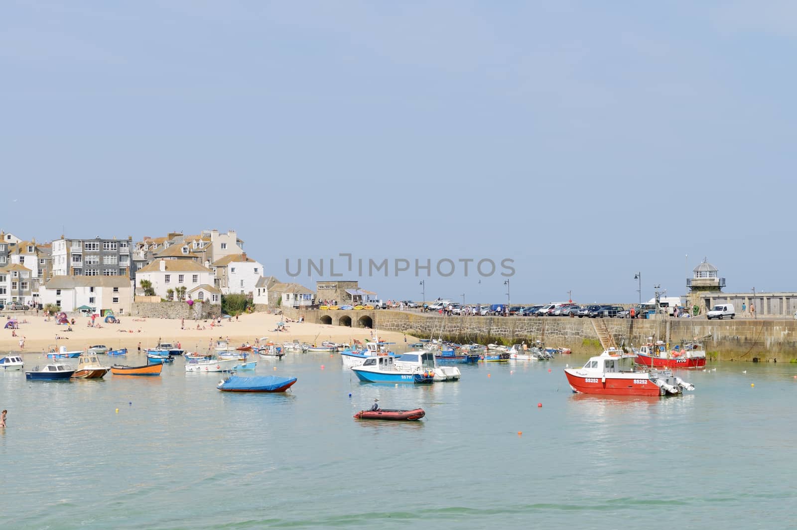 Boats by beach by kmwphotography