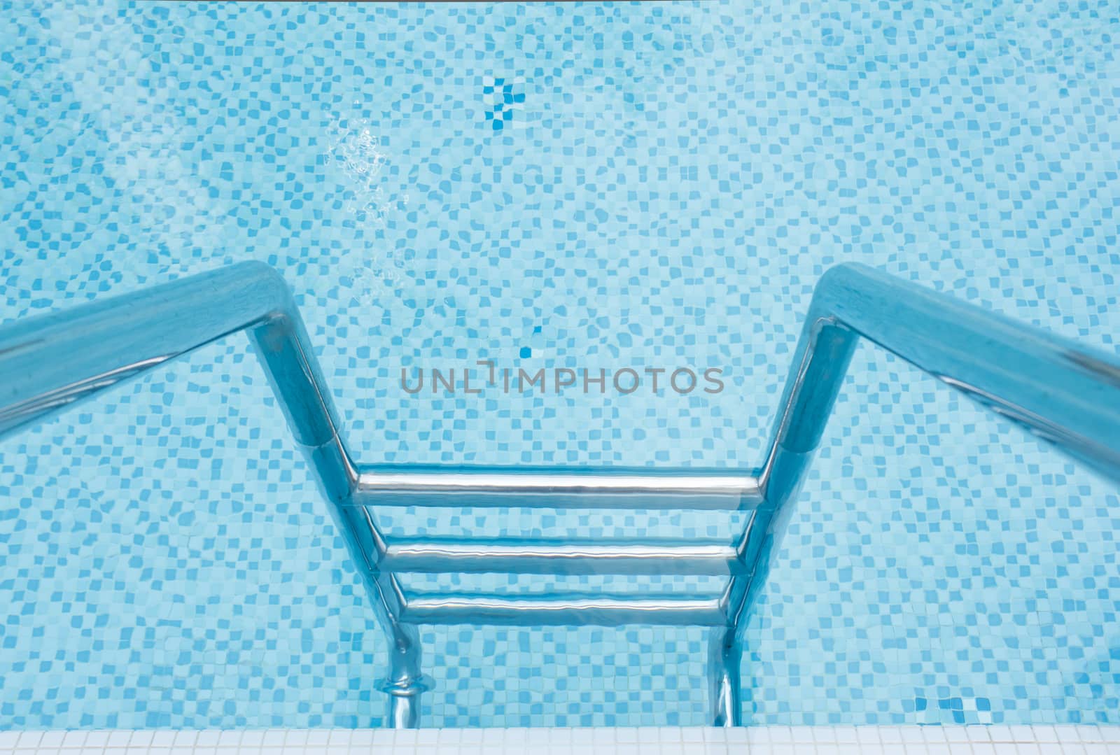 Swimming pool stairway and pattern of water