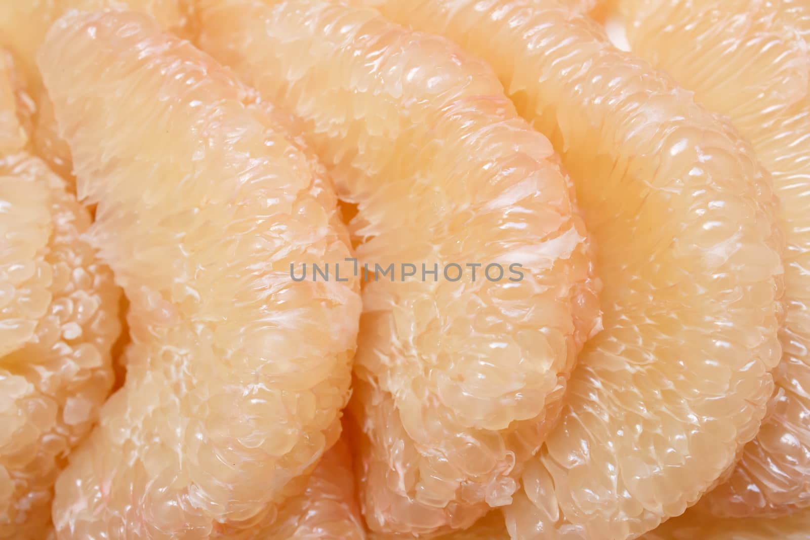 Peeled pomelo pieces fruit by vitawin