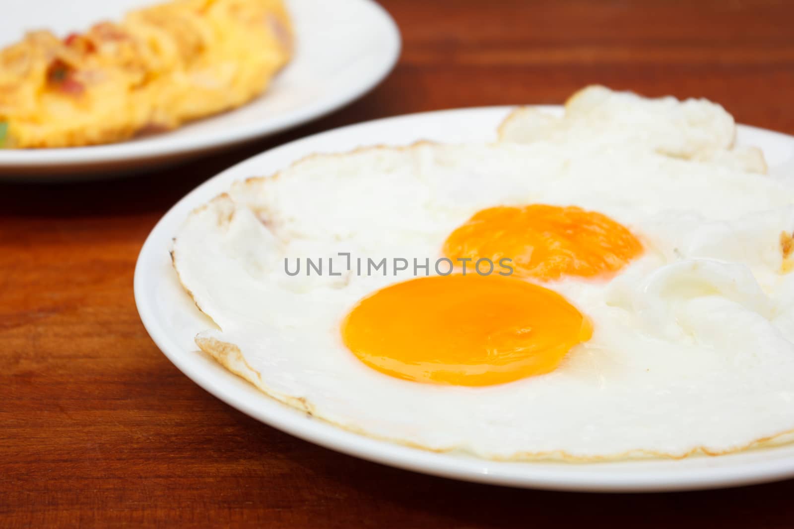 Close up Fried Eggs on Wooden Table