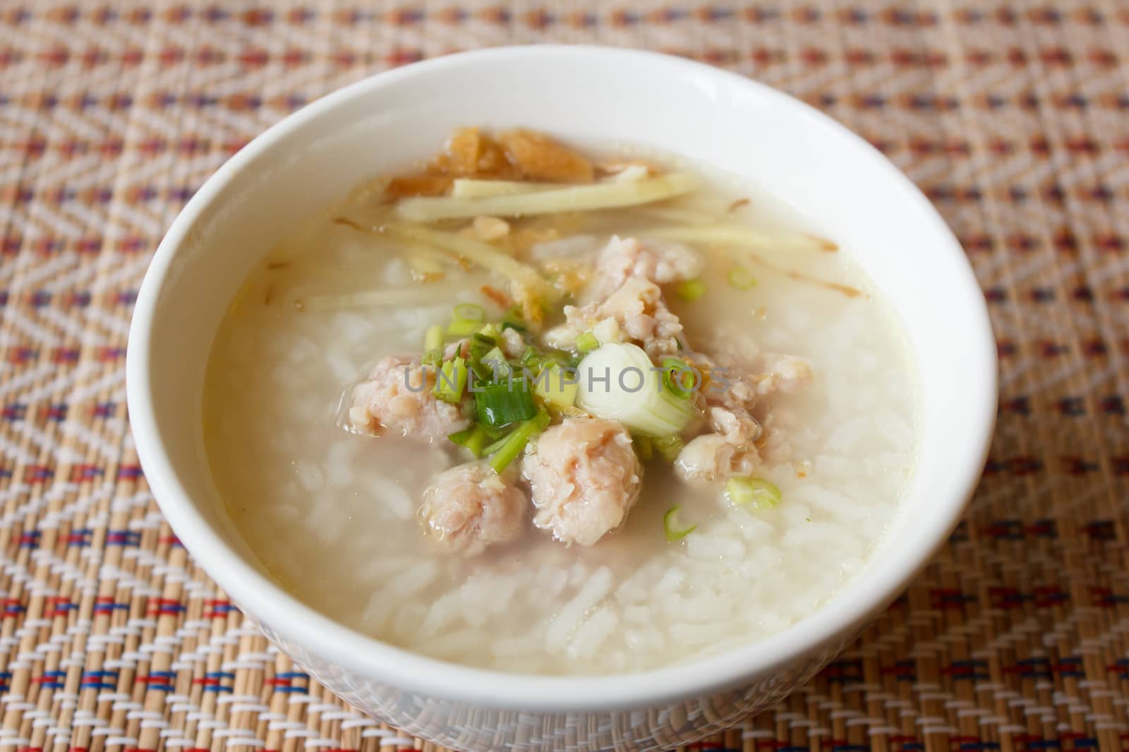 rice soup with pork in bowl