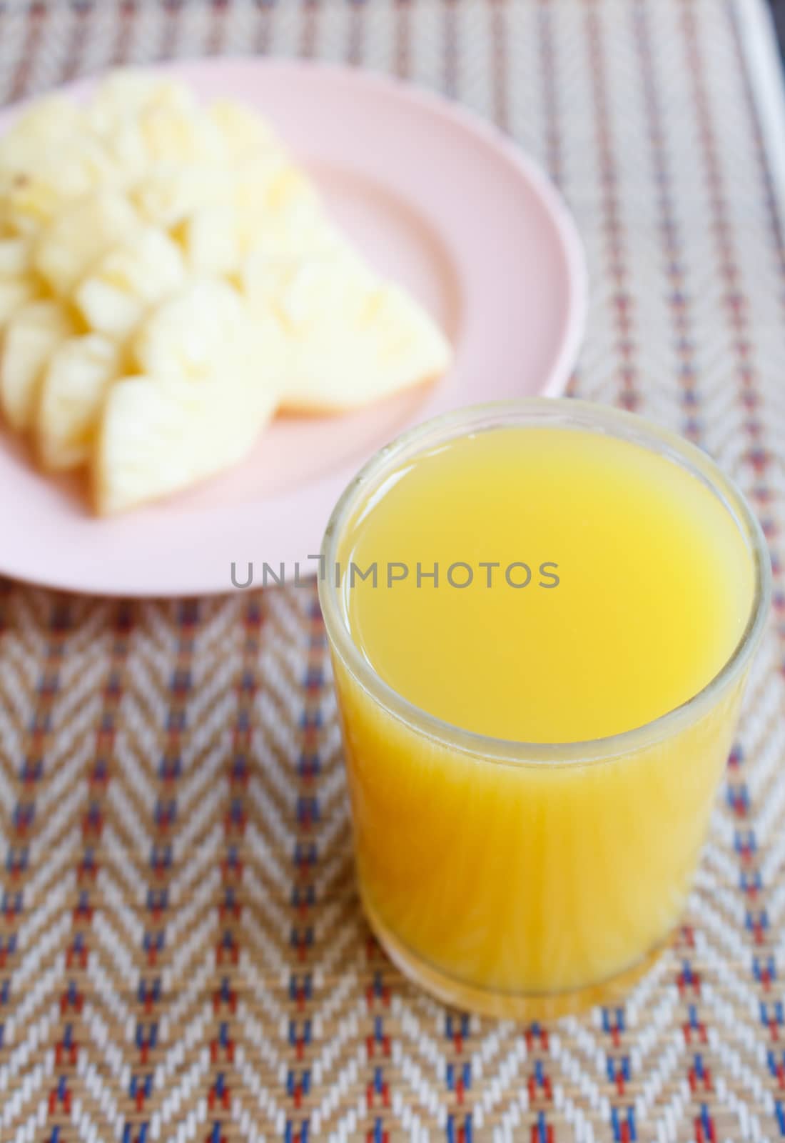 glass of Pineapple juice on mat