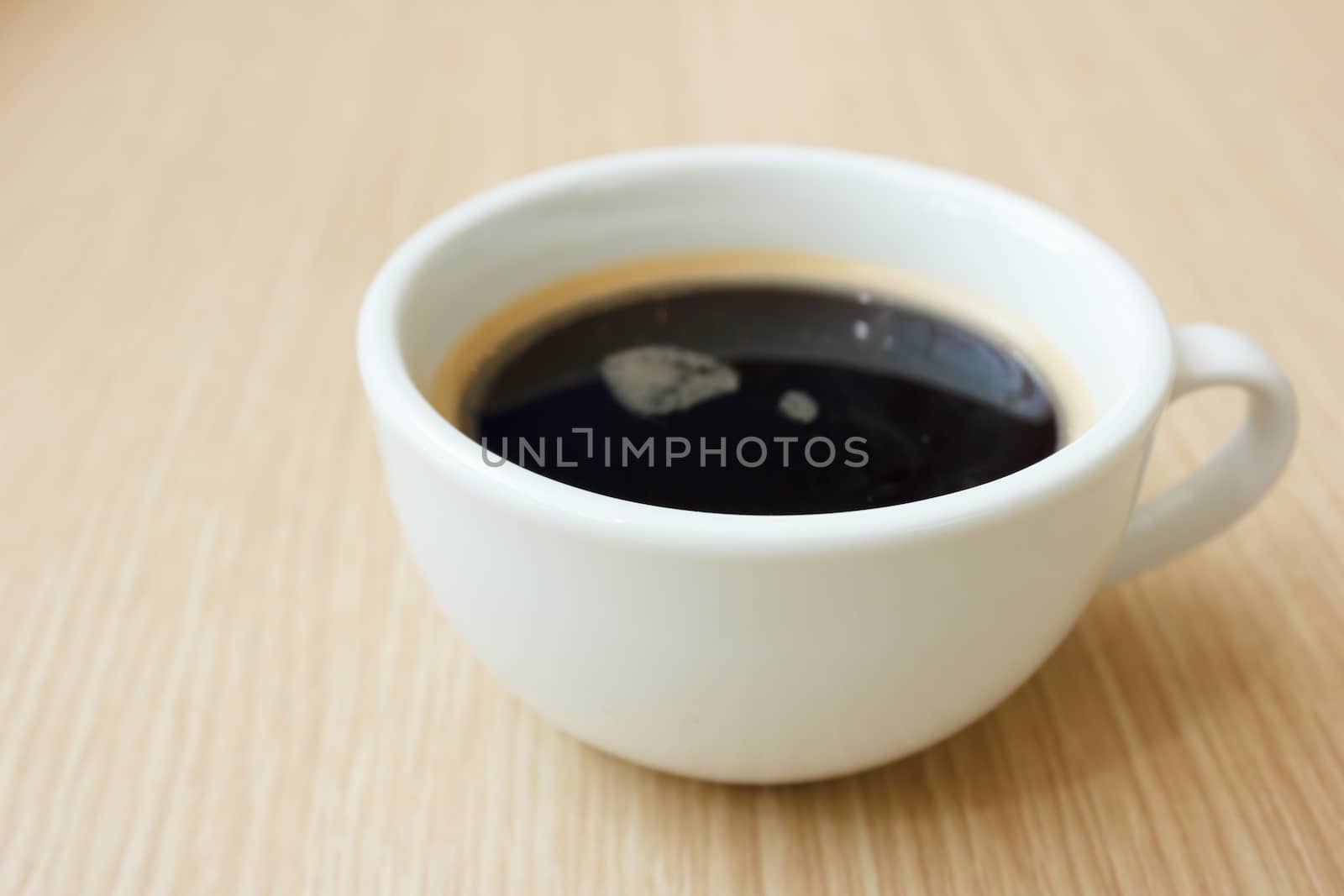close up cup of coffee  on wooden table