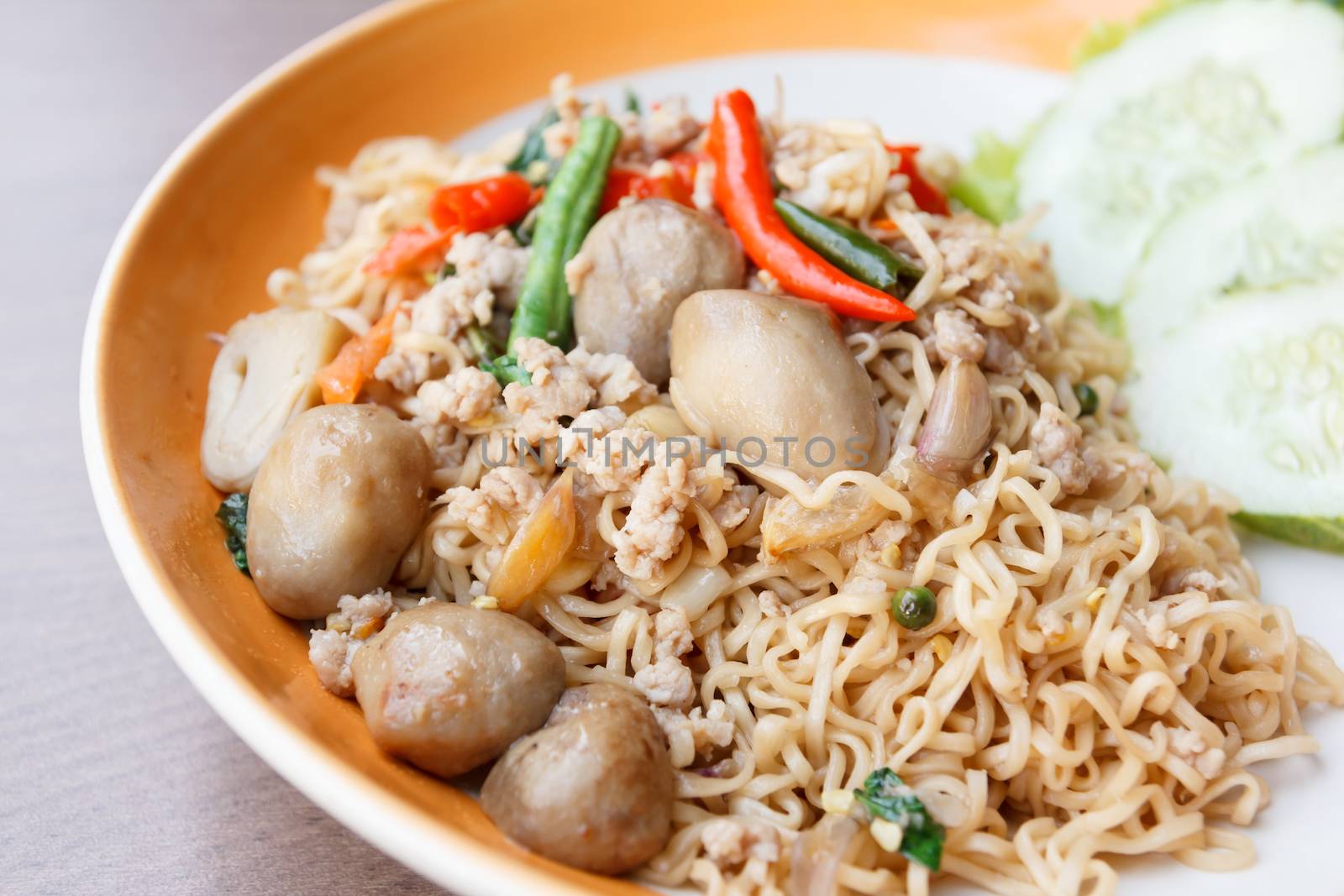 stir fried  spicy  noodle with pork and straw mushroom (thai food)