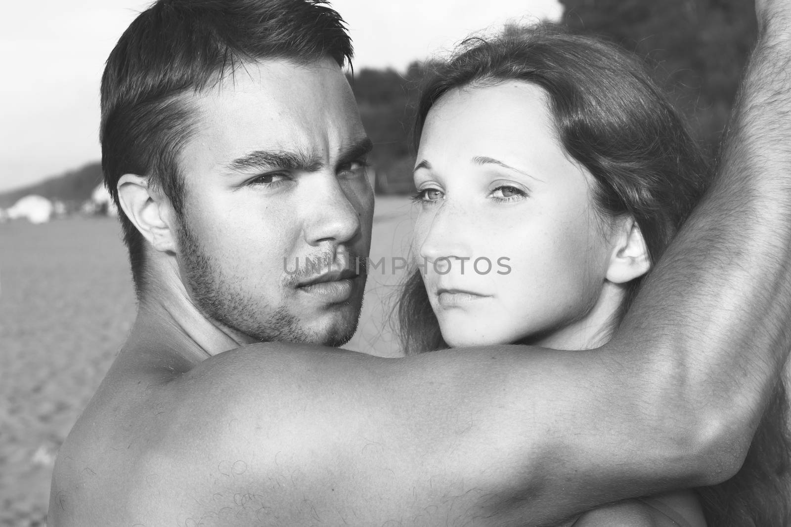 Summer, sea. Attractive couple on the beach