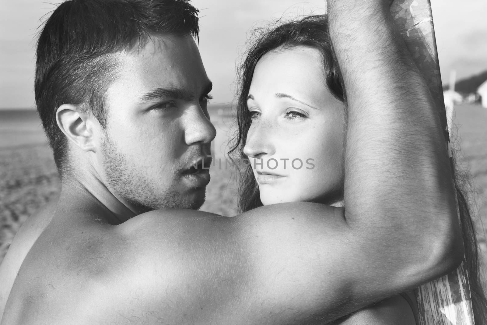 Summer, sea. Attractive couple on the beach