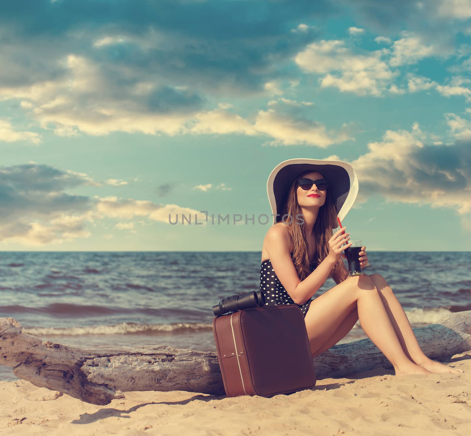 Beauty, summer. Cute, attractive woman on the beach