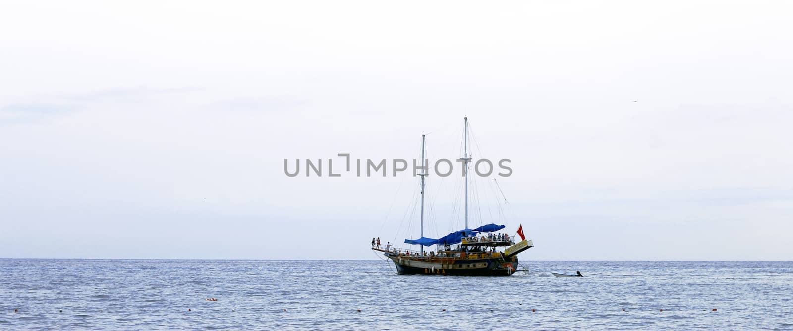 Sail ship moving away from the shore